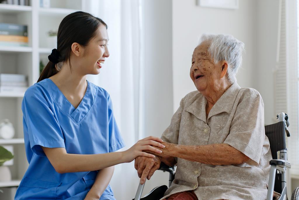 a nurse caring an old woman