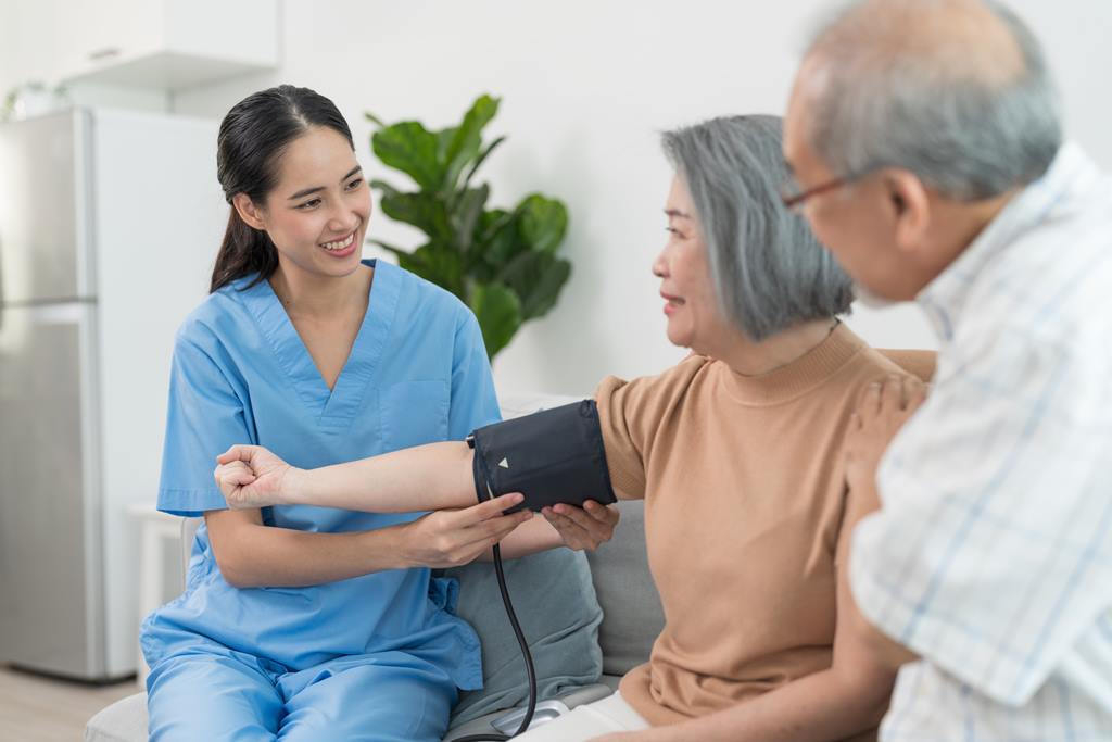 a nurse is measuring blood pressure for a patient