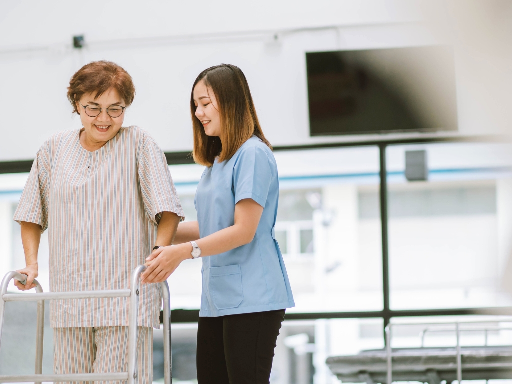 a nurse caring an old woman